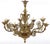 An elegant pair of English gilt bronze eight light chandeliers with beautiful botanical motif details all around the...