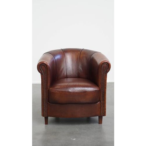 Offered this elegant sheep leather club chair in a beautiful dark cognac color with a beautiful finish. This sheep leather...