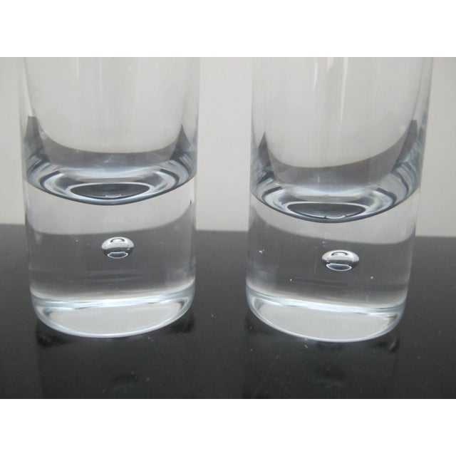 Sleek Kosta Boda, mid century modern style 'Pippi' skinny tumbler glass set of 4. Clear glass with single suspended air...