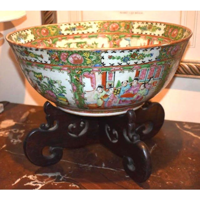 Chinese export Rose Medallion Punch Bowl of the 19th century. Finely done figures in a garden setting are surrounded by...