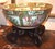 Chinese export Rose Medallion Punch Bowl of the 19th century. Finely done figures in a garden setting are surrounded by...