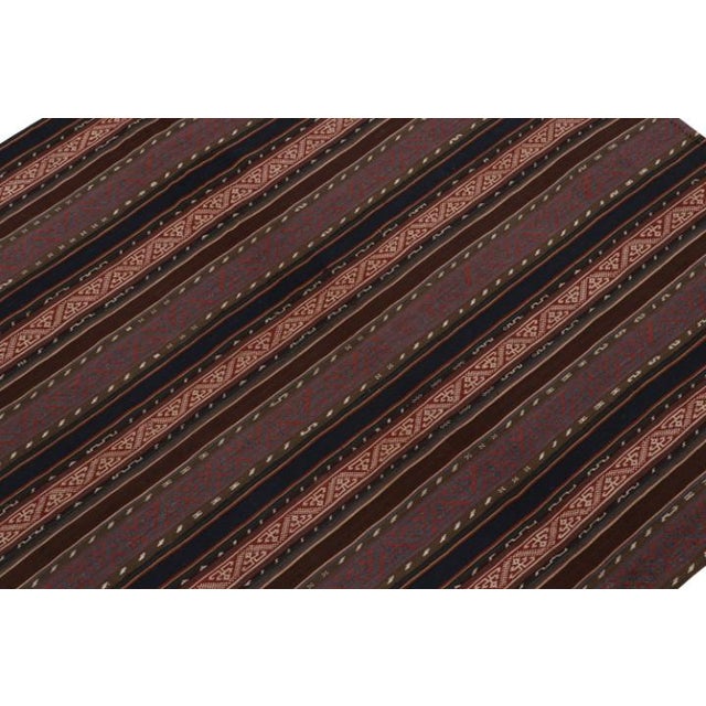 This vintage 5x5 Persian kilim is handwoven in wool, and originates circa 1950-1960. On the Design: Specifically a...