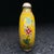 This striking vintage snuff bottle is a beautiful example of cloisonné enamel craftsmanship. The flattened, flask-shaped...