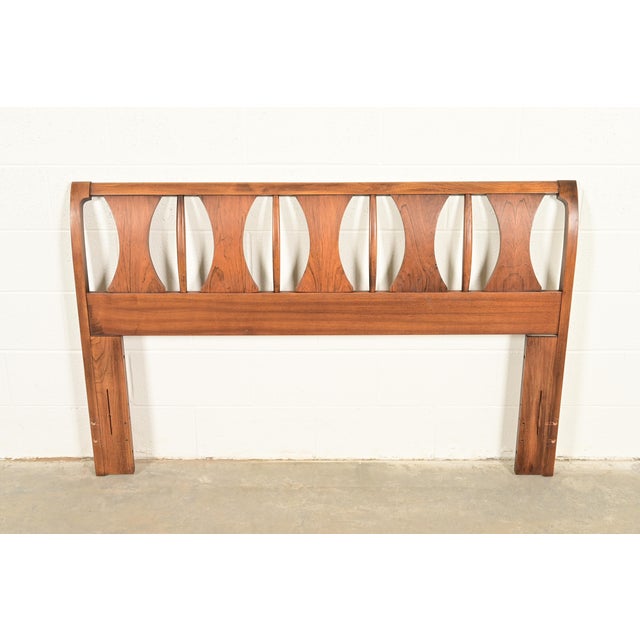 A beautiful Mid-Century Modern sculpted walnut and rosewood queen size headboard By Kent Coffey, "Perspecta" Collection...