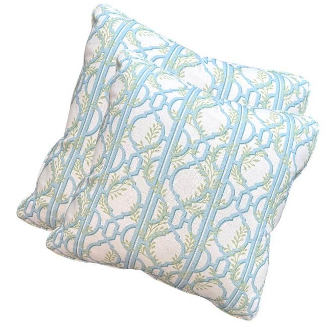 Add a touch of coastal charm to your space with this decorative throw pillow, featuring a fresh lattice and vine motif in...