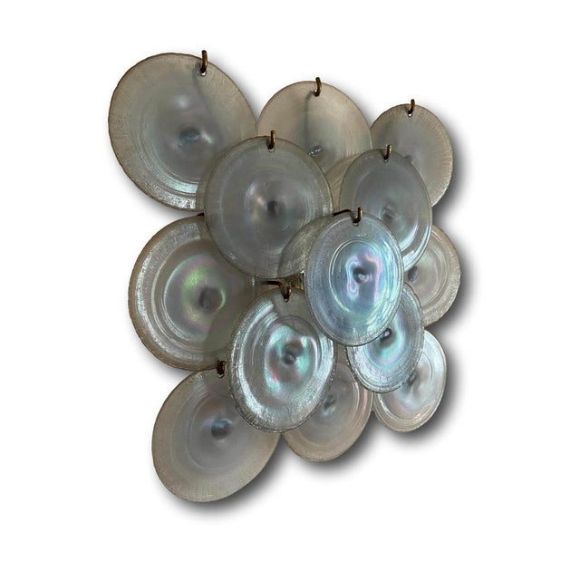 Large disc-shaped applique in irridescent Murano glass from Mazzega Murano, Italy 1960. The applique rests on a nickel-...