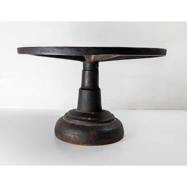 We are selling this great looking cast iron stand. We believe this may have been a table top sculptor’s stand or used for...
