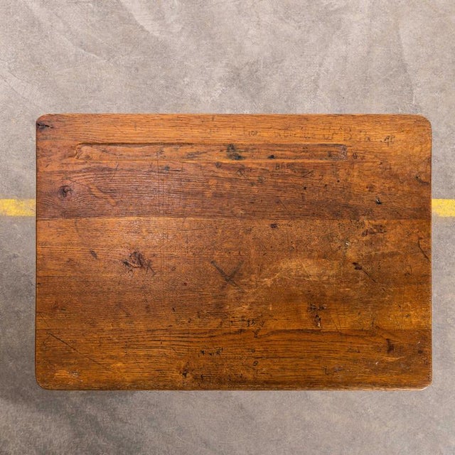 This desk is a classic sixties school desk, tubular metal legs in the classic mullca aqua green with a well used beech top...