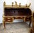 A very decorative French Louis XV style bureau à cylindre, finished in richly figured mahogany veneers and mounted...