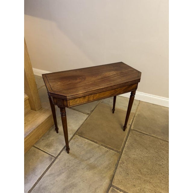 Antique george iii quality mahogany tea table, having a quality figured mahogany lift up top with a reeded edge opening to...