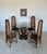 This is a Tommy Bahama-style round kitchen table, featuring a rattan wrapped pedestal base and 36" diameter glass top. If...