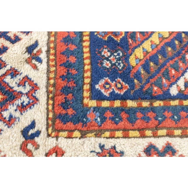 A very attractive SW Caucasian village long scatter with an ascending serrated polychrome chevron design, accented in...