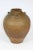 An extraordinary antiquity for the Connoisseur. The beautifully aged gradated brown earthen wine vessel from Thailand, has...