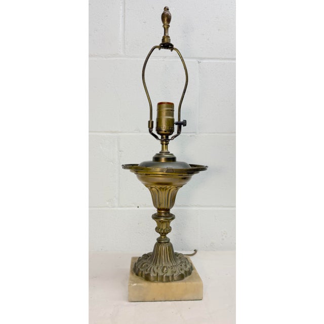 This Antique ornate electrified brass and marble astral table lamp is a stunning piece from the 19th century. With its...