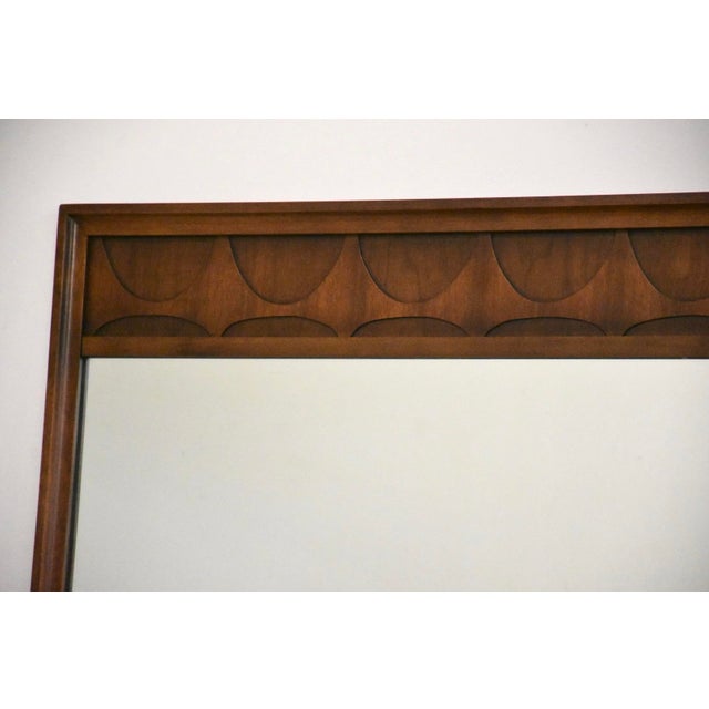 A mid century modern walnut mirror by Broyhill Brasilia. Unmarked. Excellent condition