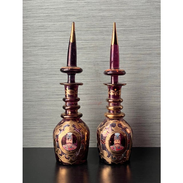 Pair of Antique Bohemian Ruby Glass Decanters, Hand-Blown and Hand-Painted, with Gold Gilt and Qajar-Era Portraits...