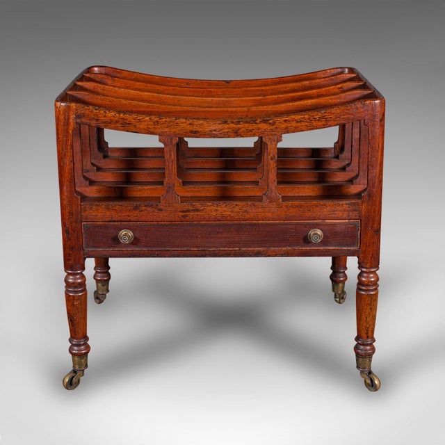 This is an antique low profile Canterbury. An English, mahogany 4 division newspaper or magazine stand, dating to the...