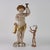 Putto torch holder in carved, lacquered and gilded wood. This piece is attributed to the mentioned designer/maker. It has...