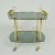 This is an unusual elegant bar cart, cocktail or serving trolley in brass and smoked glass Italy circa 1960's. The...
