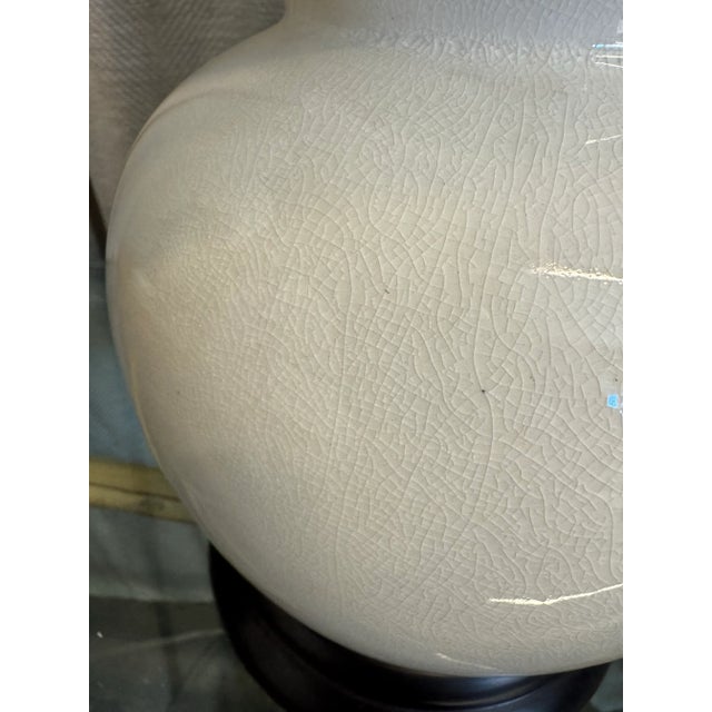 Vintage white bone color glazed cracked Chinoiserie porcelain, over a wood black stained base, double gourd table lamp...