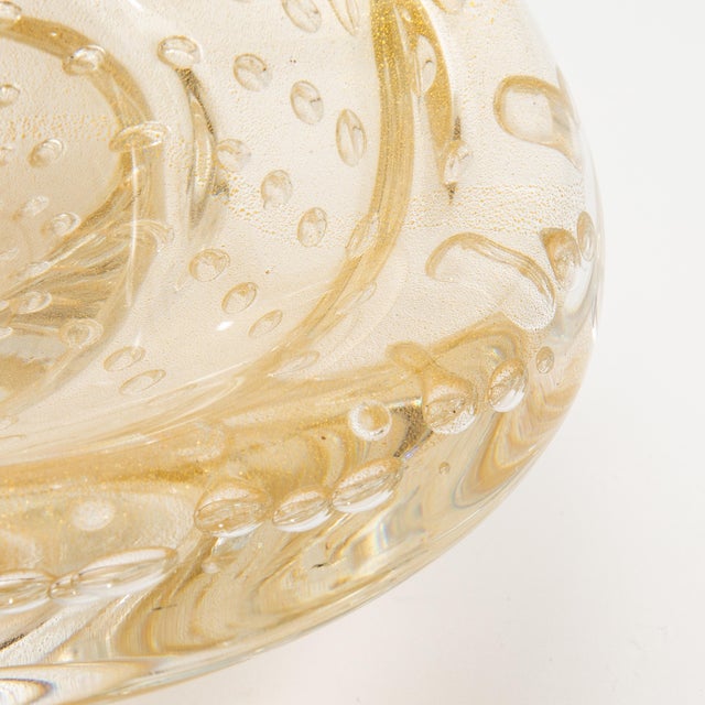 This exquisite hand-blown Murano dish embodies timeless Italian craftsmanship, showcasing a delicate fusion of artistry...