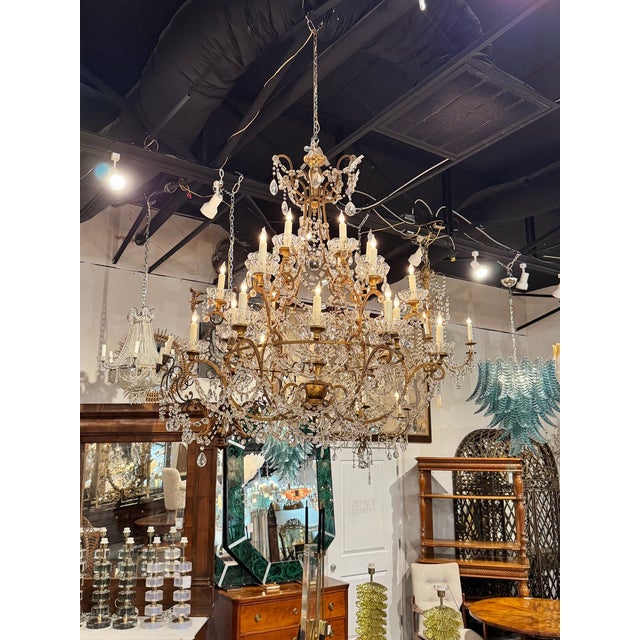 This 19th century Italian macaroni bead chandelier is a unique and elegant lighting fixture that adds a touch of history...