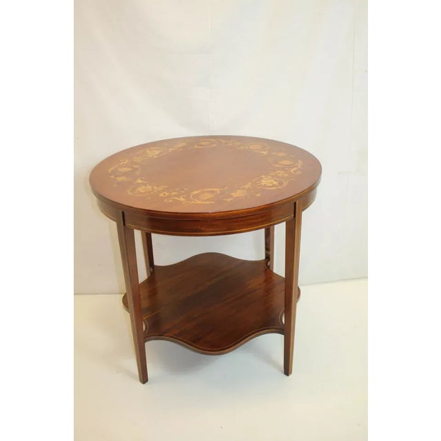 Spectacular English Hepplewhite side center table circa 1920's, featuring a circular top with beautiful inlay of flowers,...