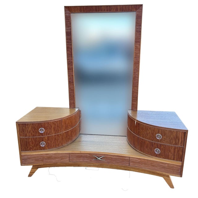 Early Mid-century vanity with matching stool by Paul Frankl for Brown Saltman company features his trademark combed wood...