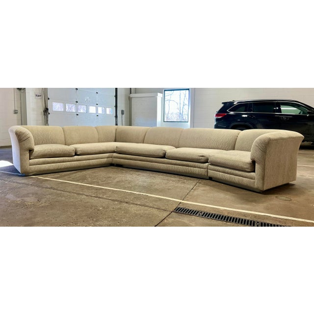 Large vintage mid century era 3 piece sectional sofa. It has a recessed chrome paneled base. This is a very solidly built...