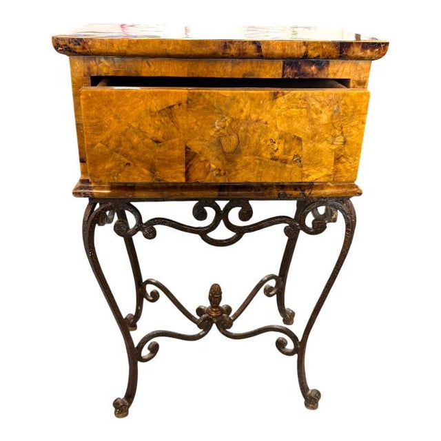 An exceptional vintage tessellated burl wood nightstand or side table featuring a striking geometric veneer case raised on...