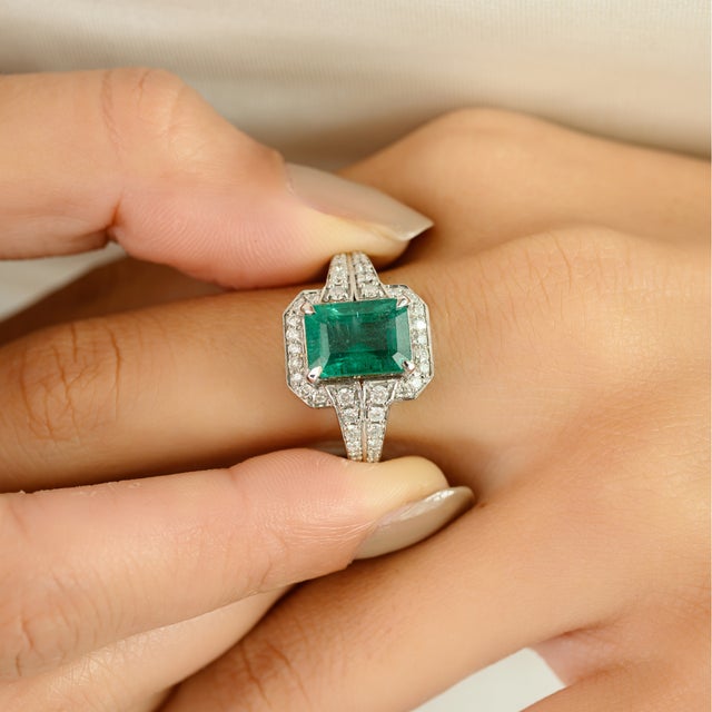 Elevate your jewelry collection with this exquisite 14K white gold Zambian emerald and diamond ring, showcasing an elegant...