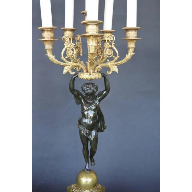 Late 19th C. Pair of Empire style Candelabras held by baby Fairies. Made in France, circa 1880's.