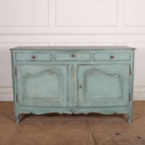 Early 19th century French painted buffet with three drawers above two shaped doors. 1820. This piece is designed in the...