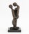 Family Embrace Bronze Sculpture, illegible signature and numbered edition "6/18" near base, mounted atop a black marble...