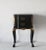 A handsome Louis XV style black lacquered nightstand, end or side table, reminiscent of La Maison London. Decorative gold...