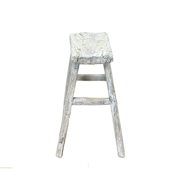 This is a rustic, handcrafted wooden stool featuring a simple yet sturdy design that exudes timeless charm. The stool has...