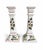 A graceful pair of hand-painted ceramic candlesticks with tall, architectural square-column silhouettes. Each is decorated...
