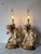 Elegant pair of vintage French table lamps featuring sculptural putti (cherubs) in an intimate embracing pose, inspired by...