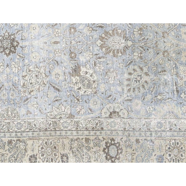 This Semi Antique Persian Tabriz Rug, handwoven in Northern Iran’s Tabriz region, measures 8'10" x 11'2". Expertly...