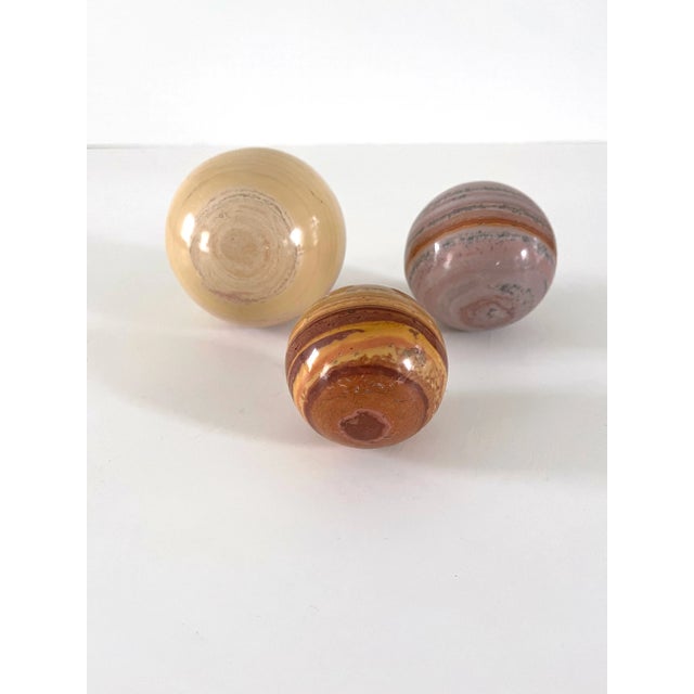 Beautiful set of three banded jasper orbs in varying sizes and colors. Graduated in size, these would look lovely on...