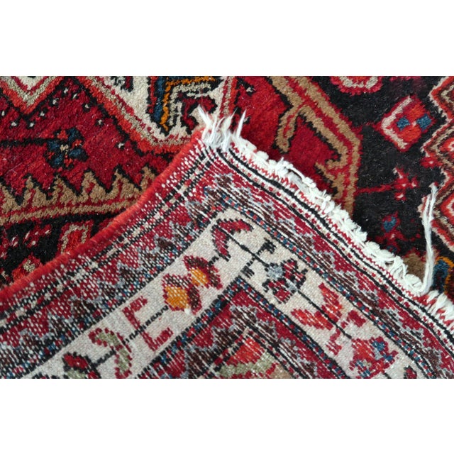 This striking antique Persian Hamadan rug is a century-old treasure from one of the Middle East's most prolific and...