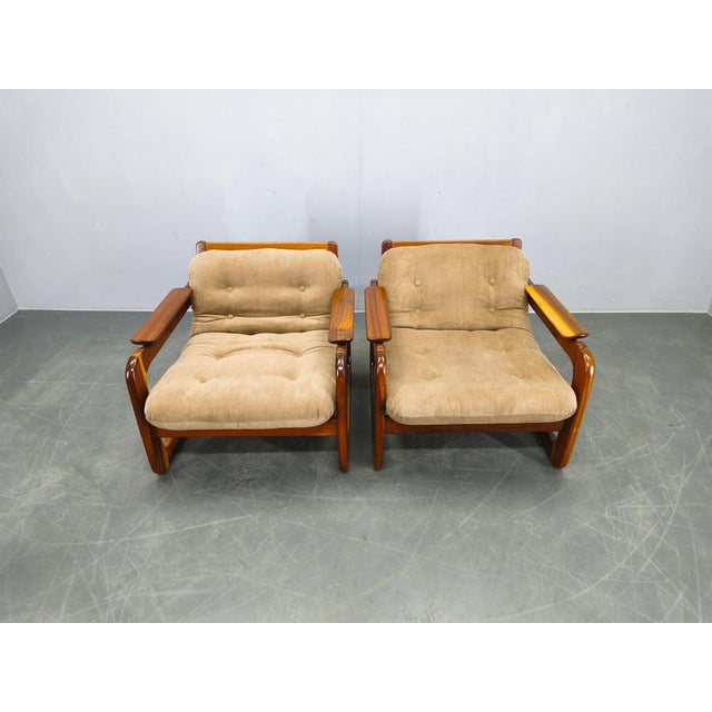 Pair of Scandinavian lounge chairs from the 1970s, crafted from solid wood and newly upholstered in corduroy fabric. These...