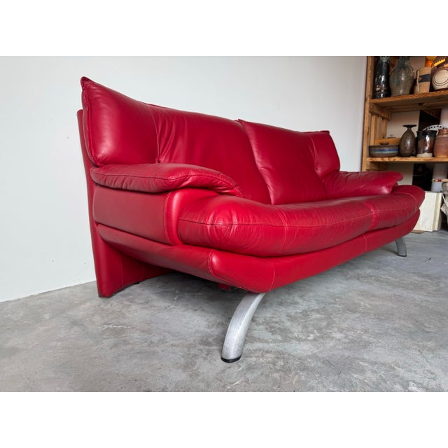 Striking vintage Postmodern Italian sofa in the style of Nicoletti Salotti, featuring bold sculptural lines and rich red...