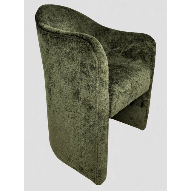 Anaya Arm chair in Olive Chenille. The curves of the Anaya Dining Armchair will cradle you in exquisite comfort. Crafted...