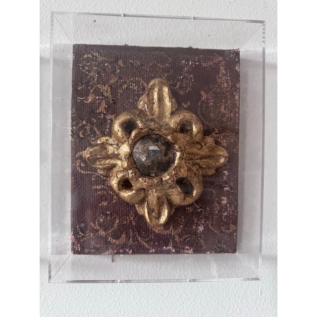 Giltwood and plaster handmade architectural fragment features an antiqued convex mirror. The architectural fragment is...