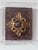 Giltwood and plaster handmade architectural fragment features an antiqued convex mirror. The architectural fragment is...