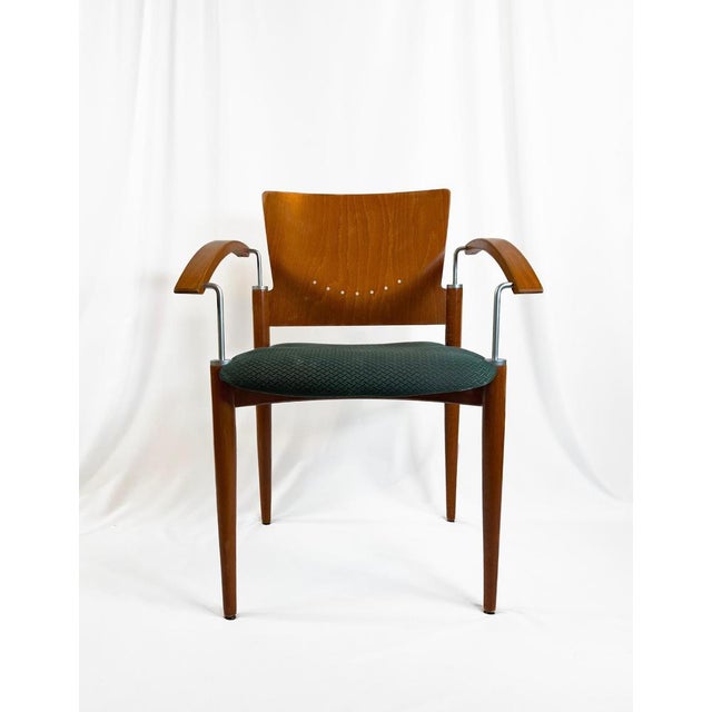 A collection of four Postmodern stackable dining chairs, attributed to Thonet, circa 1980s. These chairs have been crafted...