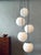 Cascade lamp by peill and putzler, 1970s. 5 pendants made of matt opal glass with chrome-plated holders conjure up a...