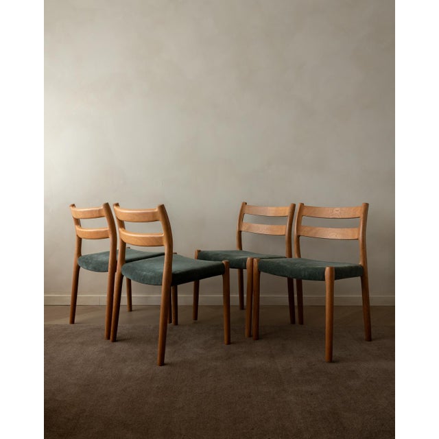 A beautiful and highly collectible set of four vintage danish model 84 dining chairs by niels otto møller for j.l. Møllers...