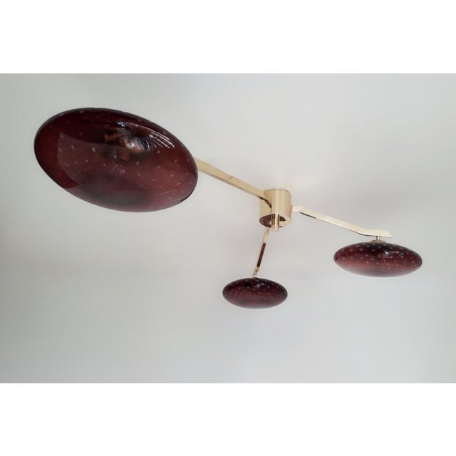 Italian flush mount with three amethyst Murano glass shades tiered at different heights, hand blown with bubbles inside...